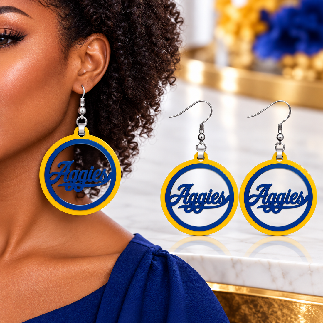 Gold and blue Aggies script hoop earrings with gold outer ring and navy script, cut from solid acrylic with silver fish hooks