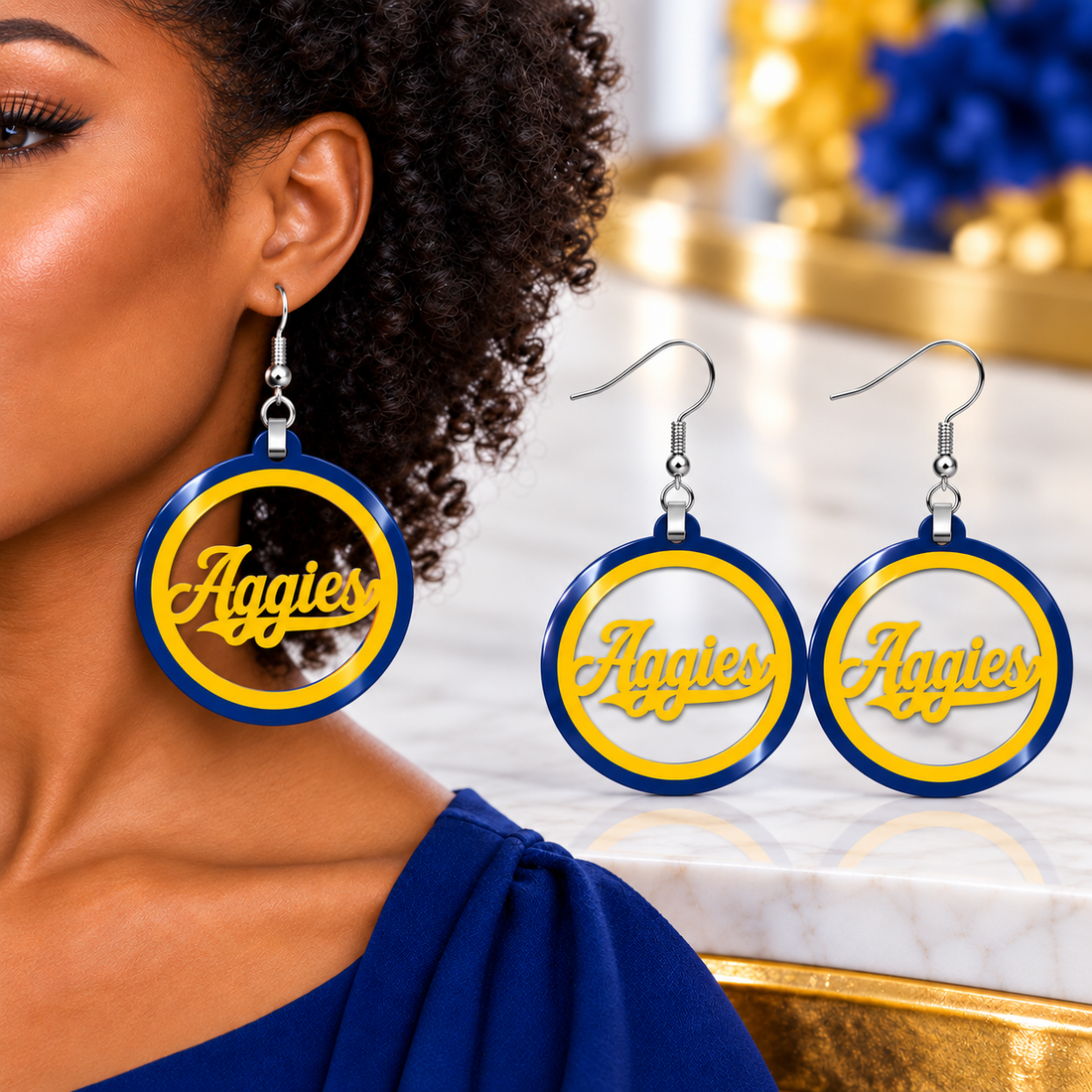 Blue and gold Aggies script hoop earrings with navy outer ring and gold script, cut from solid acrylic with silver fish hooks